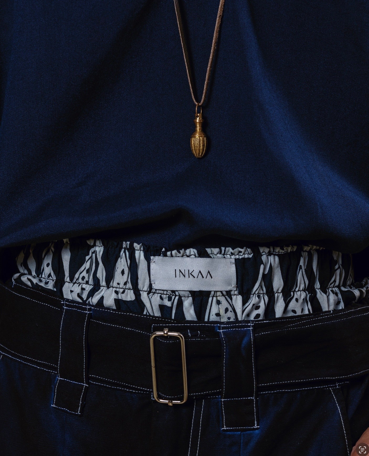 Garment-dyed Pleated Belted Pants with RESIST Lining